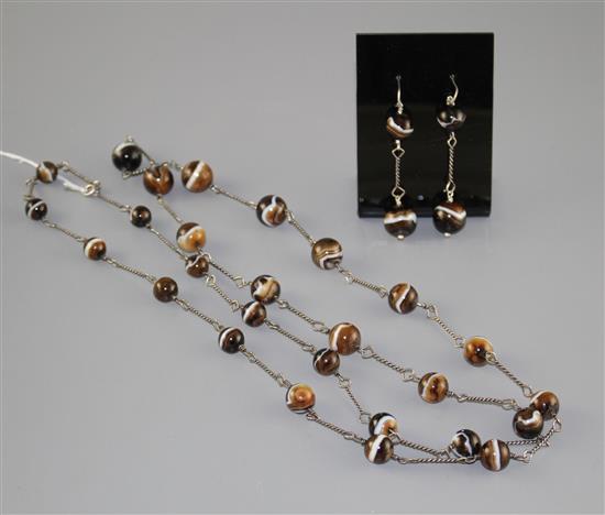 A white metal and graduated banded agate bead long necklace and pair of matching earrings, necklace 130cm, earrings 55mm.